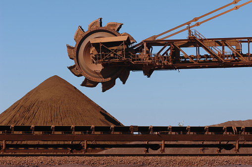 A reclaimer used to move stockpiles of crushed iron ore on a mine site. A reclaimer used to move stockpiles of crushed iron ore on a mine site.